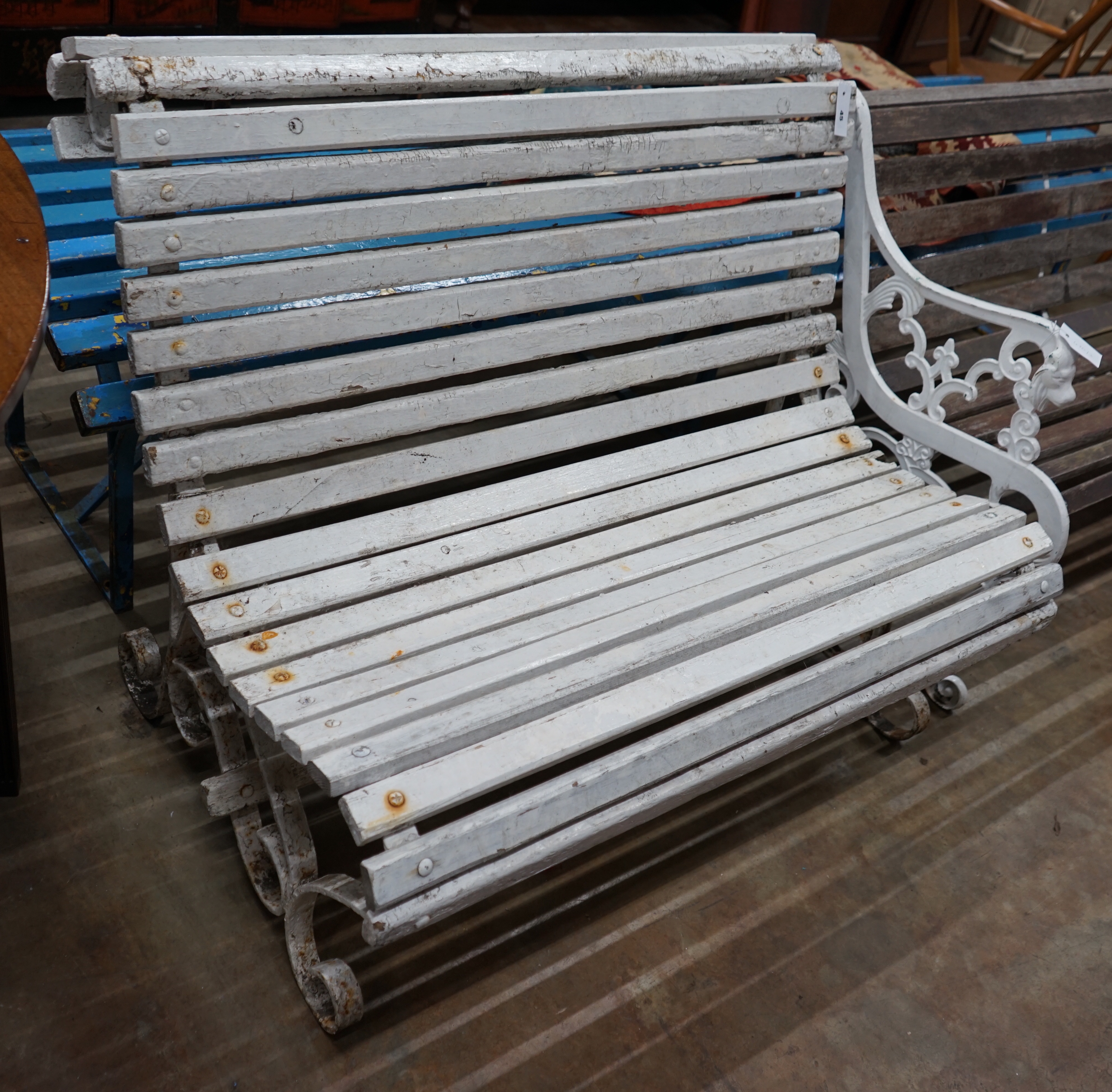 A painted slatted wood and wrought iron garden bench, length 106cm depth 74cm height 84cm